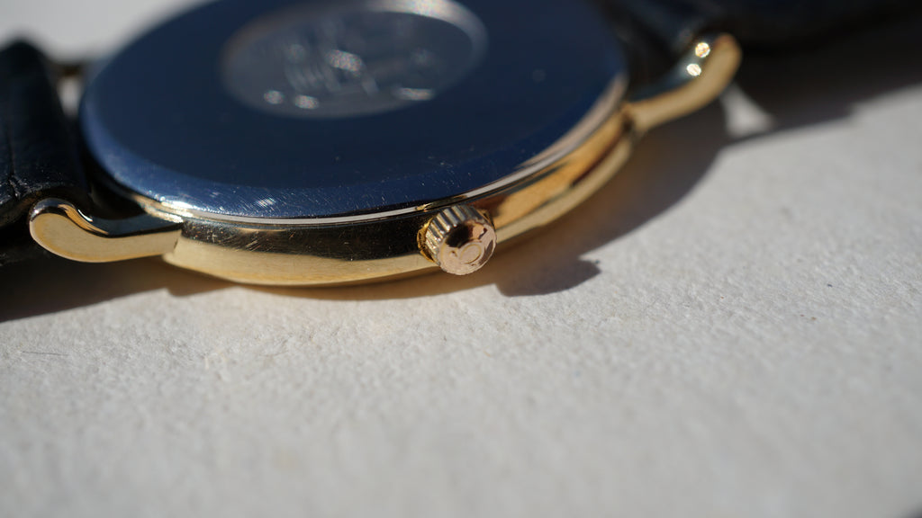 Omega De Ville Quartz Date roman dial