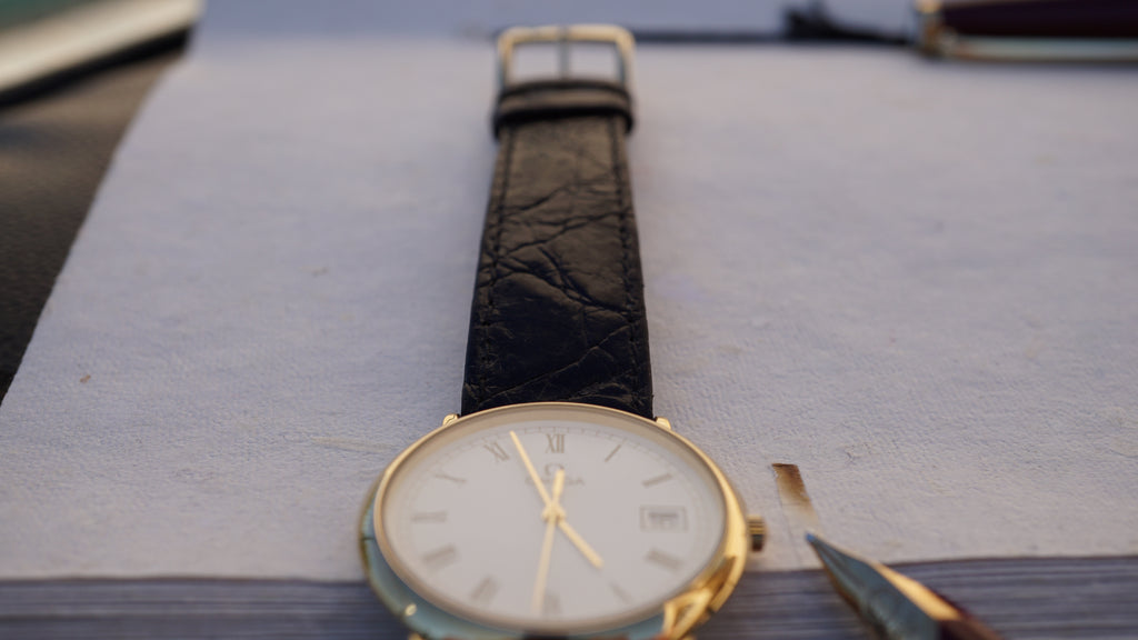 Omega De Ville Quartz Date roman dial