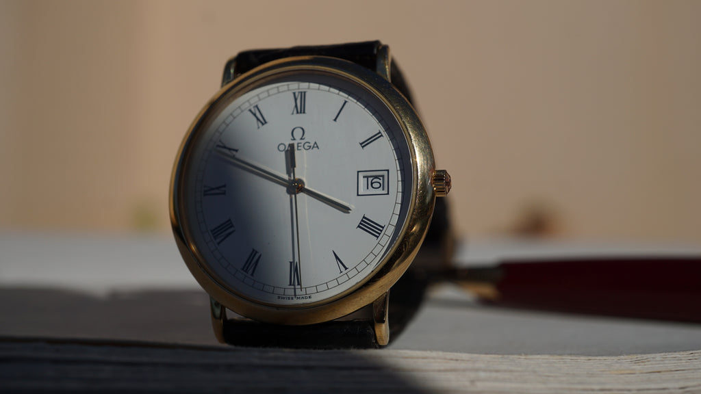 Omega De Ville Quartz Date roman dial