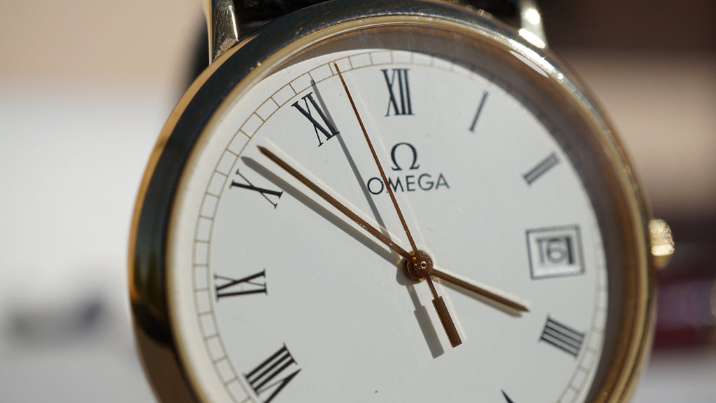 Omega De Ville Quartz Date roman dial