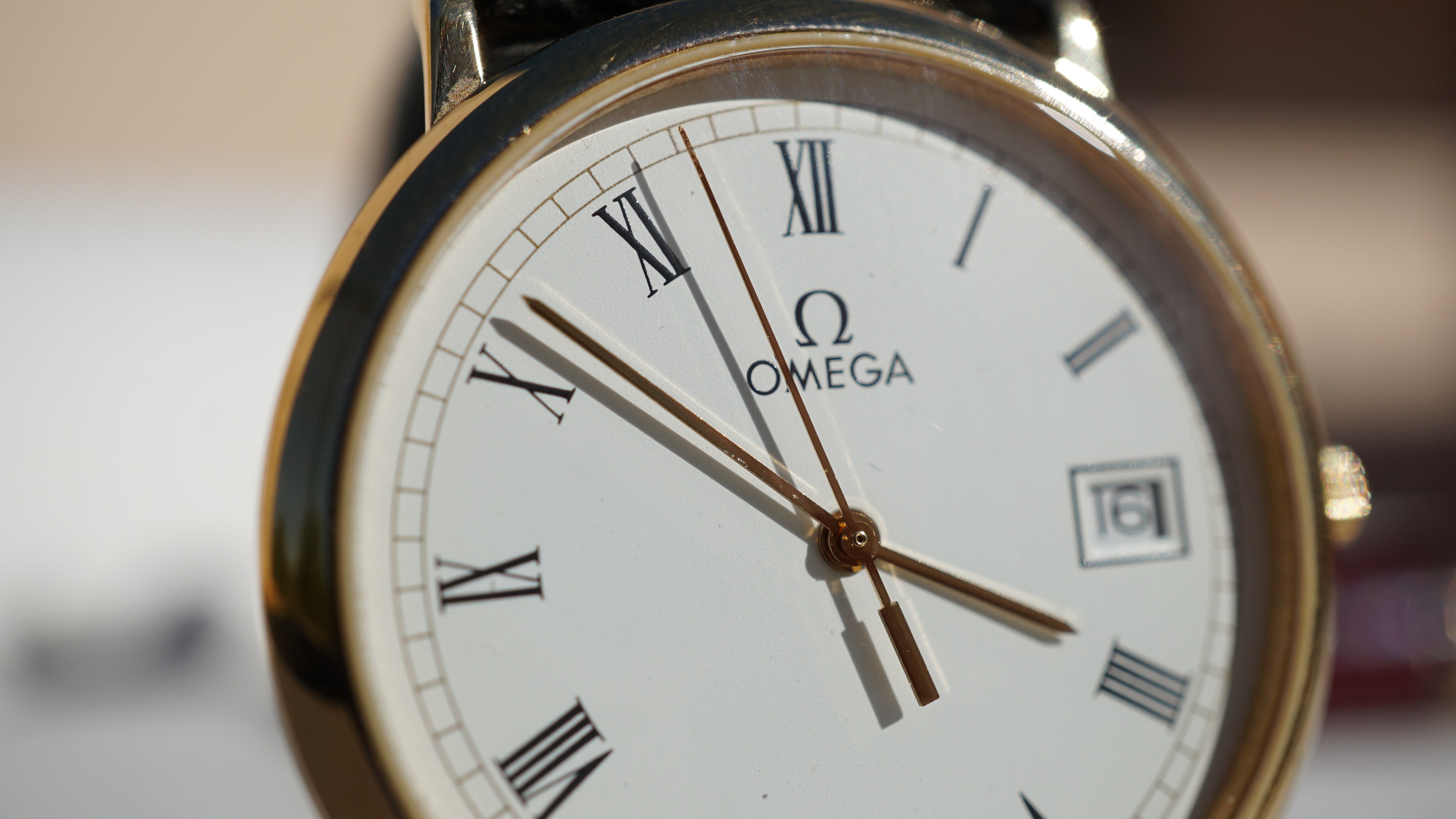 Omega De Ville Quartz Date roman dial