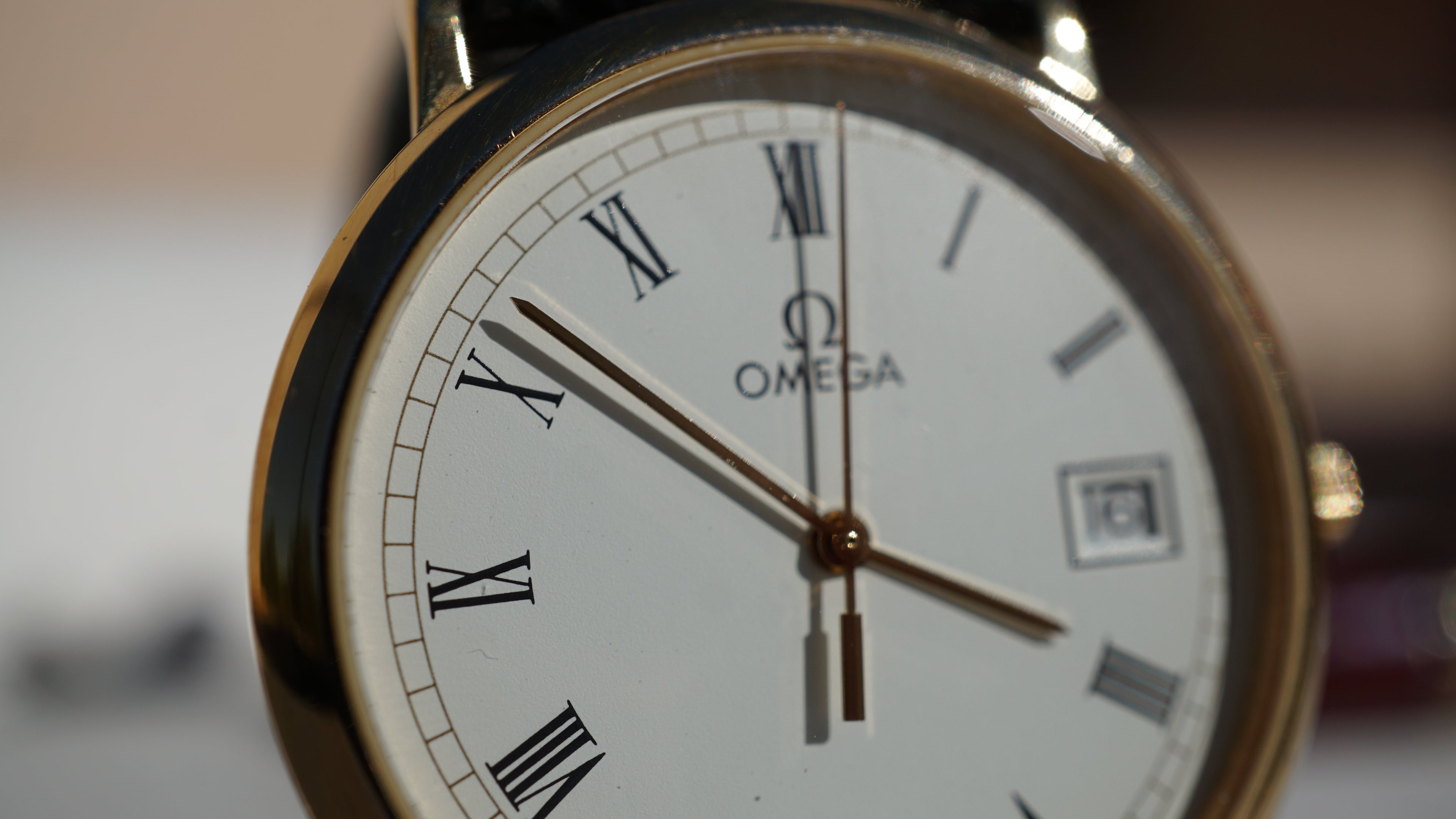 Omega De Ville Quartz Date roman dial
