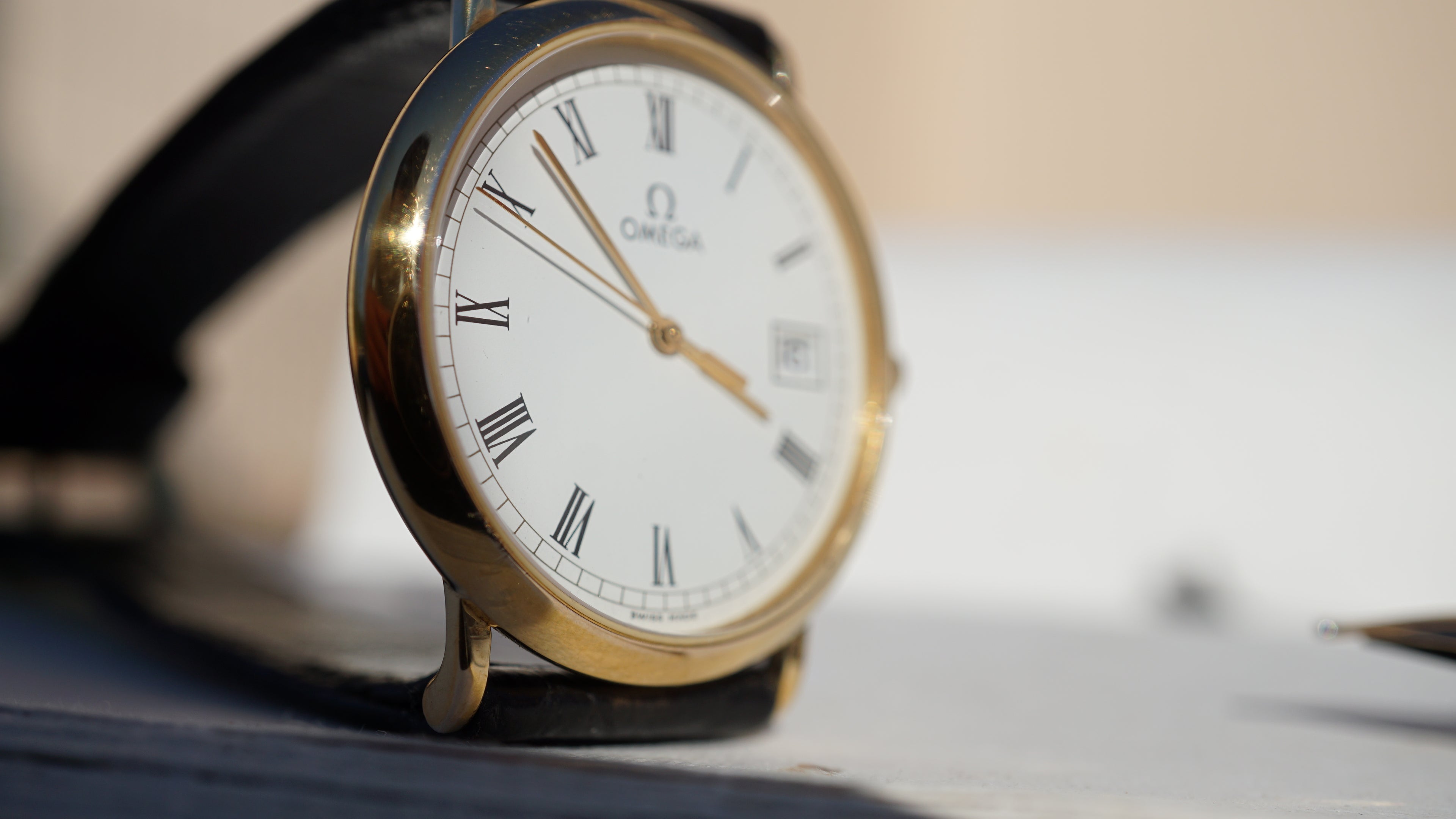 Omega De Ville Quartz Date roman dial
