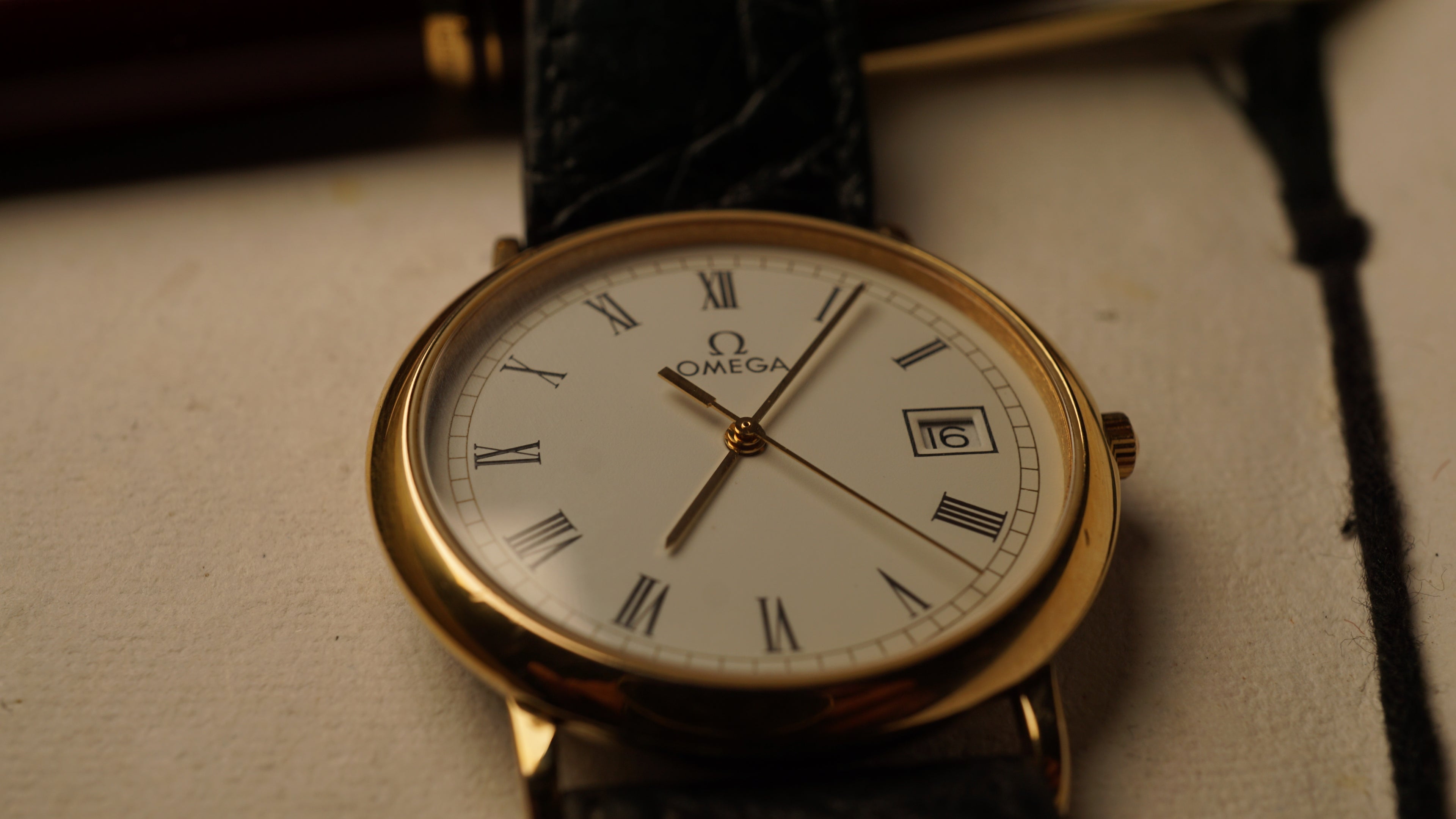 Omega De Ville Quartz Date roman dial