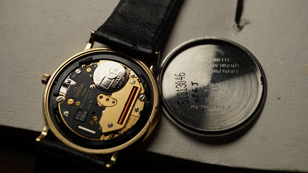 Omega De Ville Quartz Date roman dial