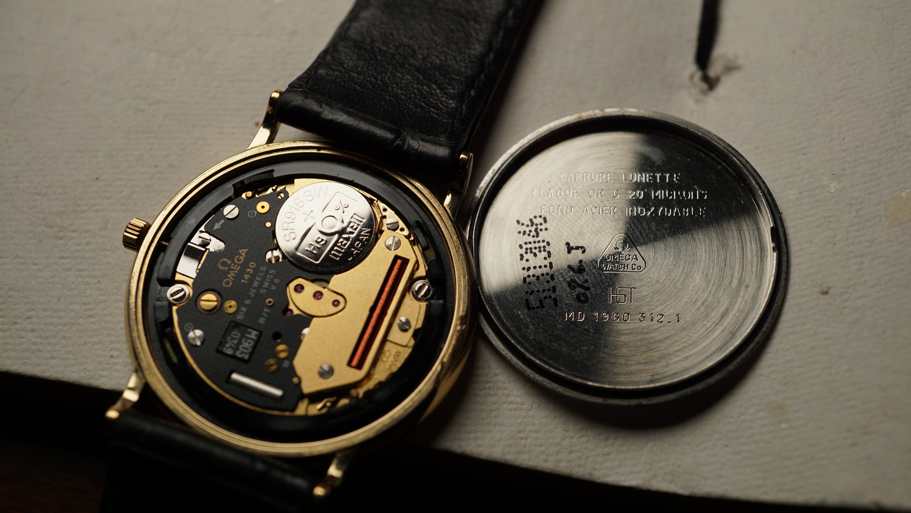 Omega De Ville Quartz Date roman dial