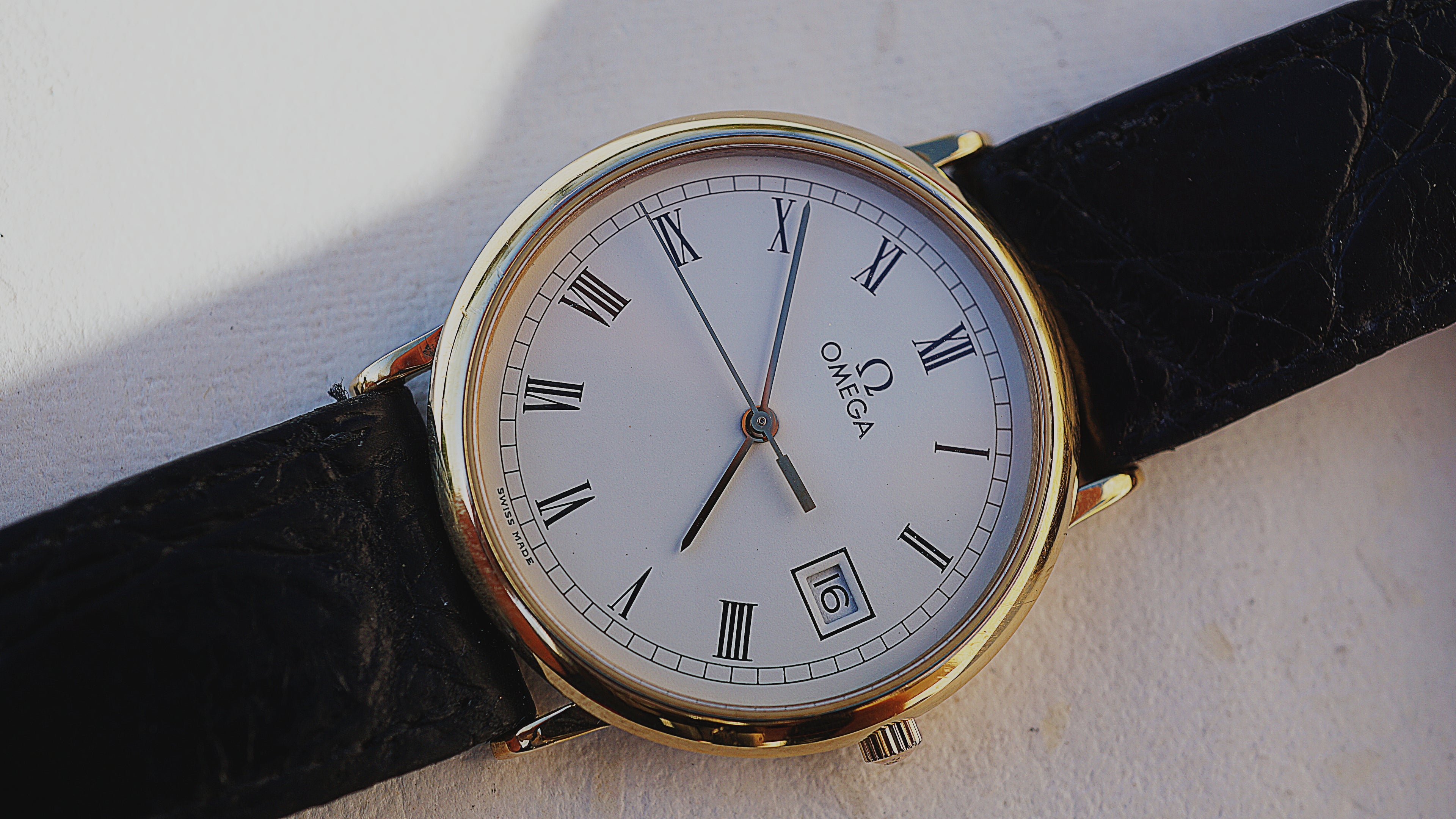 Omega De Ville Quartz Date roman dial